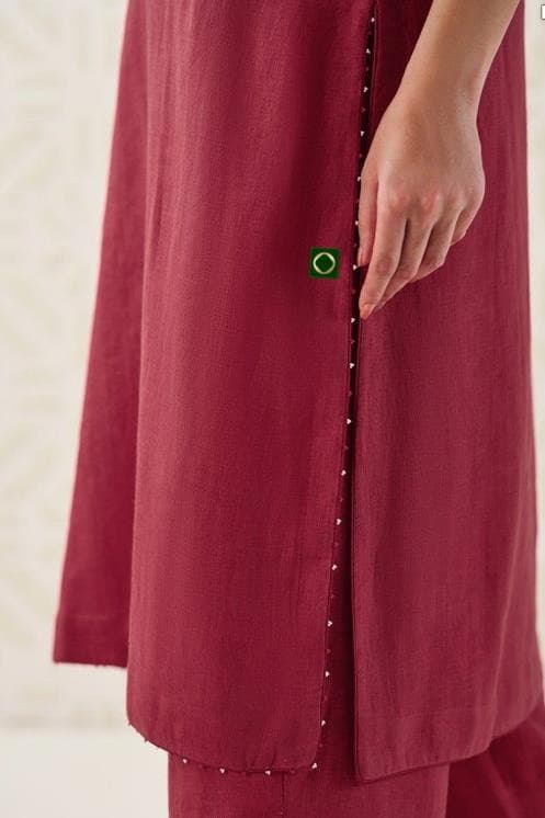 Hand-finished placket and pearl buttons on the Anjali kurta